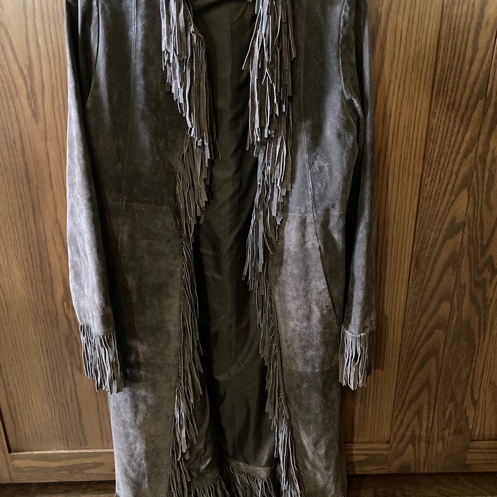 Suede calf length fringed coat.